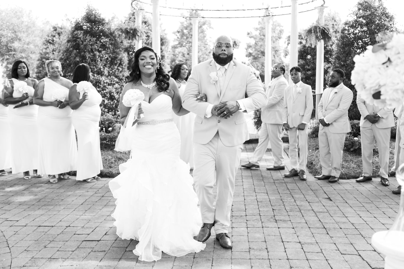 Image of Mr & Mrs. Navarro walking from wedding ceremony
