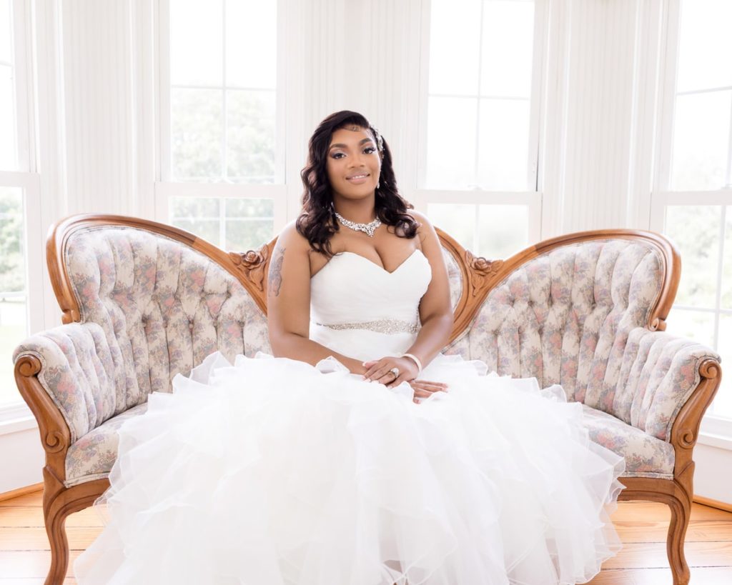 Image of Mrs Navarro sitting in a chair on her wedding day